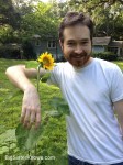 Robby with his volunteer sunflower. (Photo by Ashley Jones, 2015)